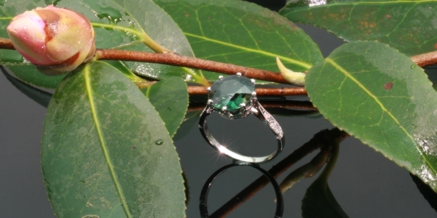 Platinum estate engagement ring with green spinel and diamonds from the antique jewelry collection of Adin Antique Jewelry Store, Antwerp, Belgium