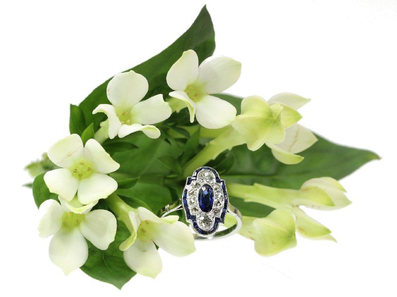 Click the picture to get to see this elegant estate platinum Art Deco diamond and sapphire engagement ring