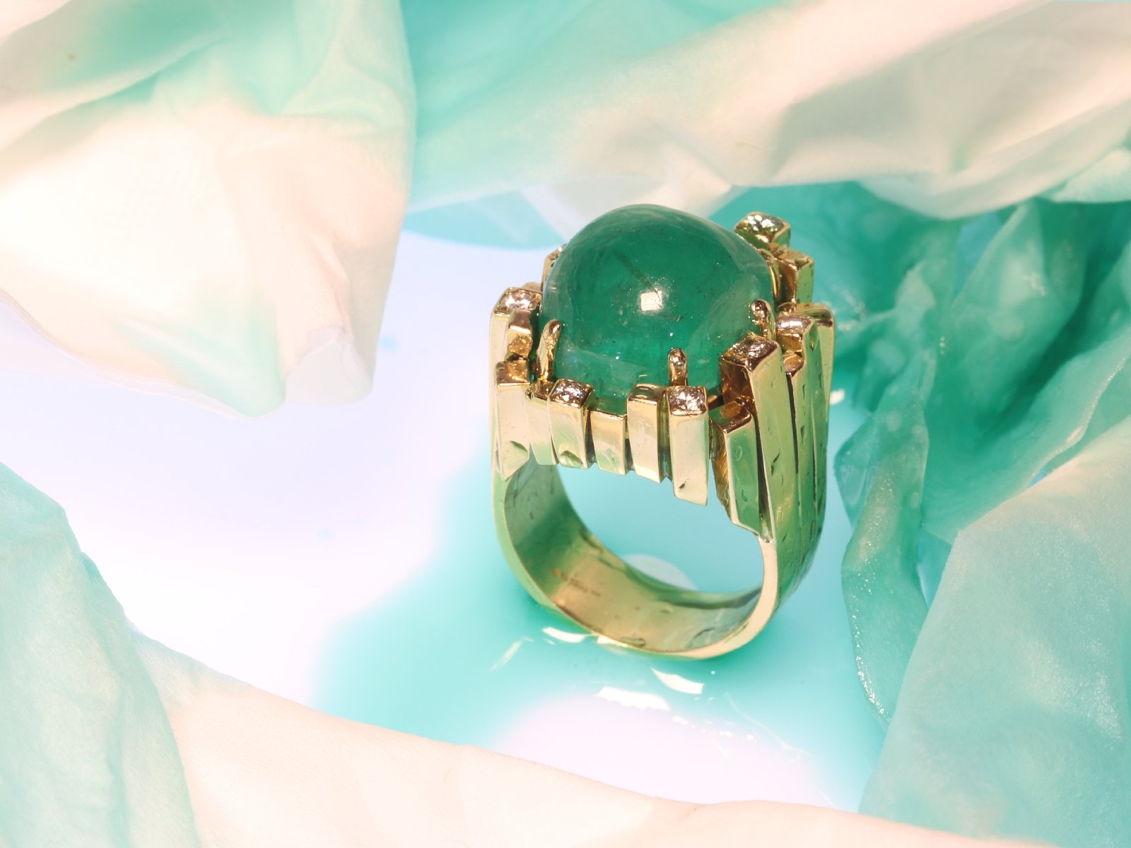 Click the picture to get to see this Vintage Seventies Modernistic Artist Design ring with large emerald and diamonds.