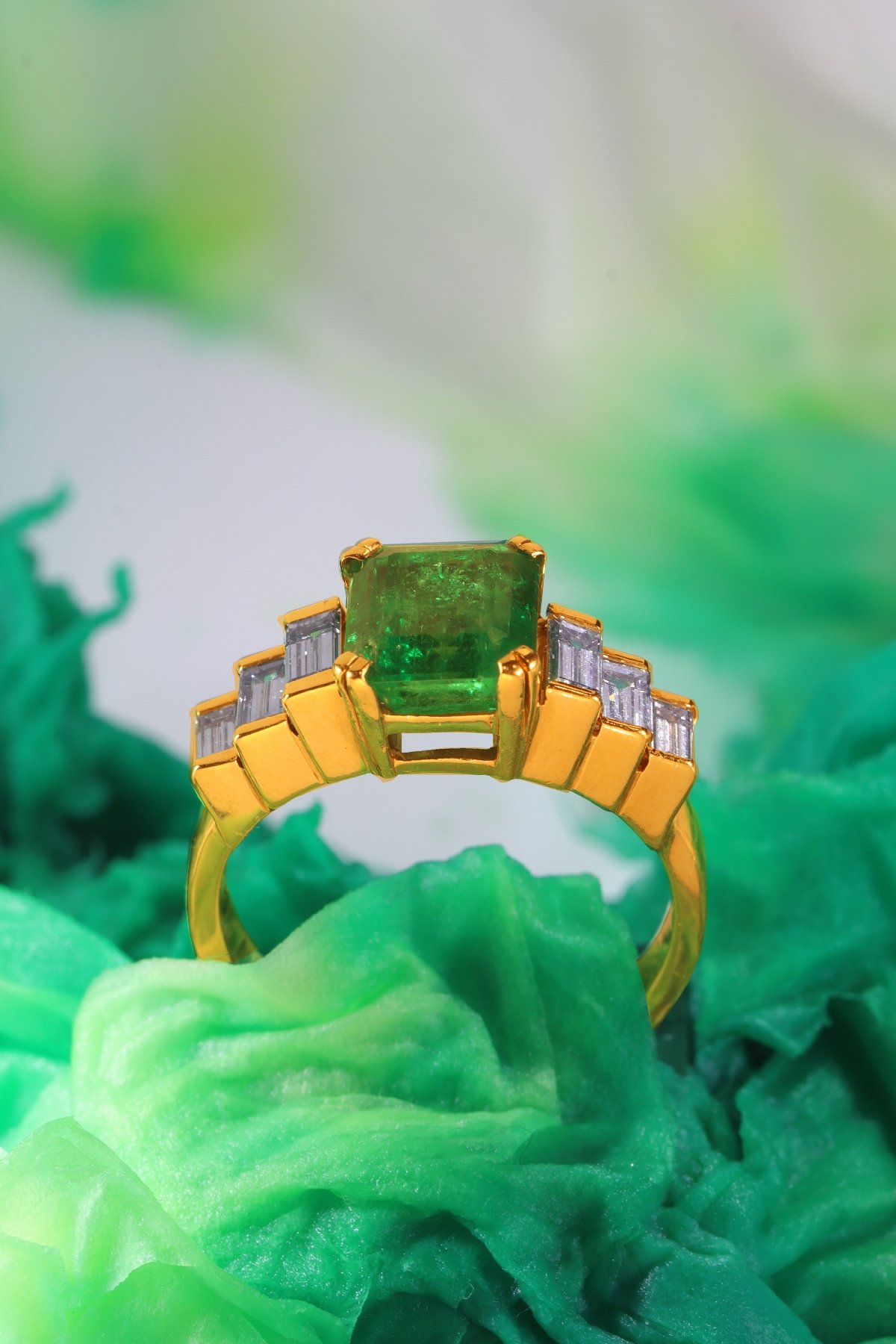 Click the picture to get to see this Vintage French estate ring with high quality Colombian emerald and baguette diamonds.