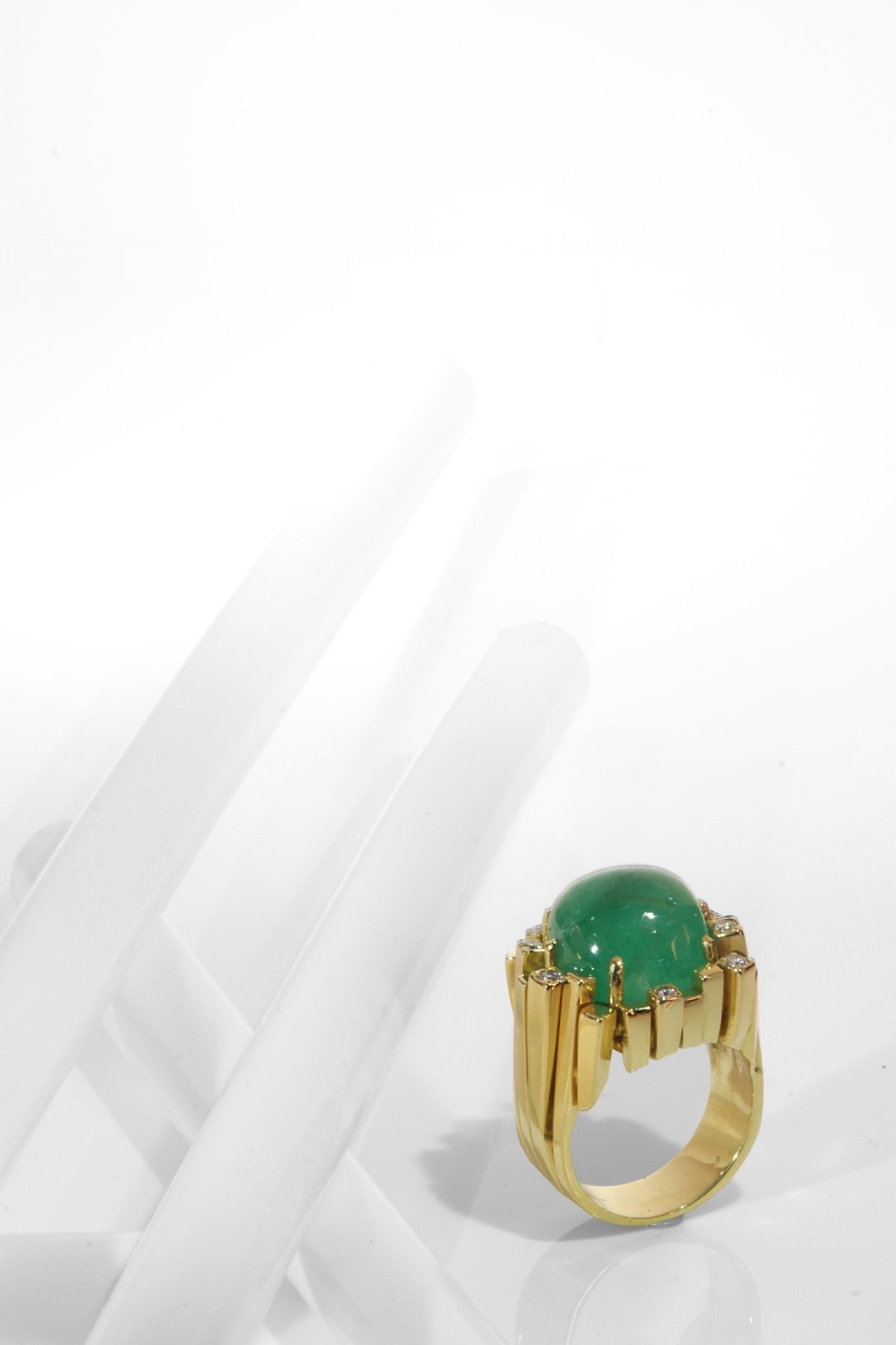 Click the picture to get to see this Seventies Modernistic Artist Design ring with large emerald and diamonds.
