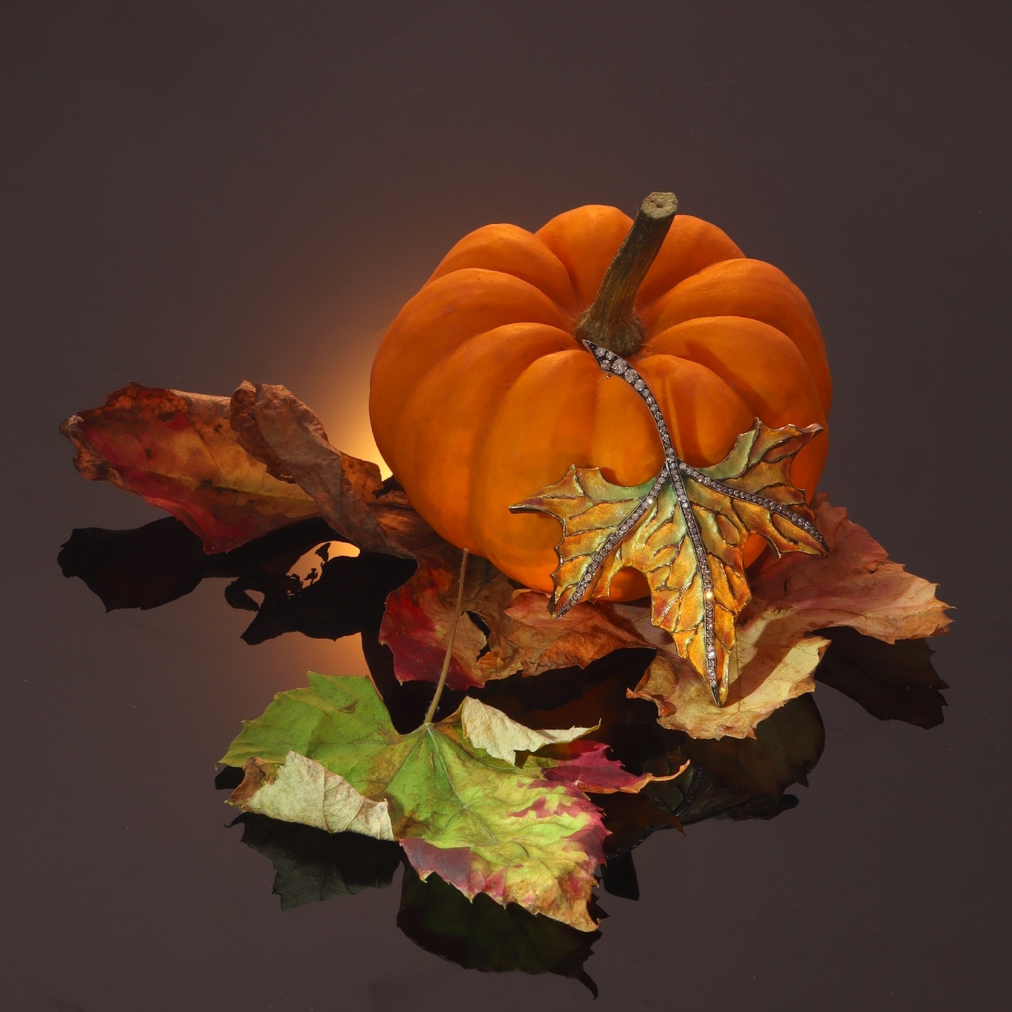 Click the picture to find out more about this vintage gold and diamond autumn leaf brooch