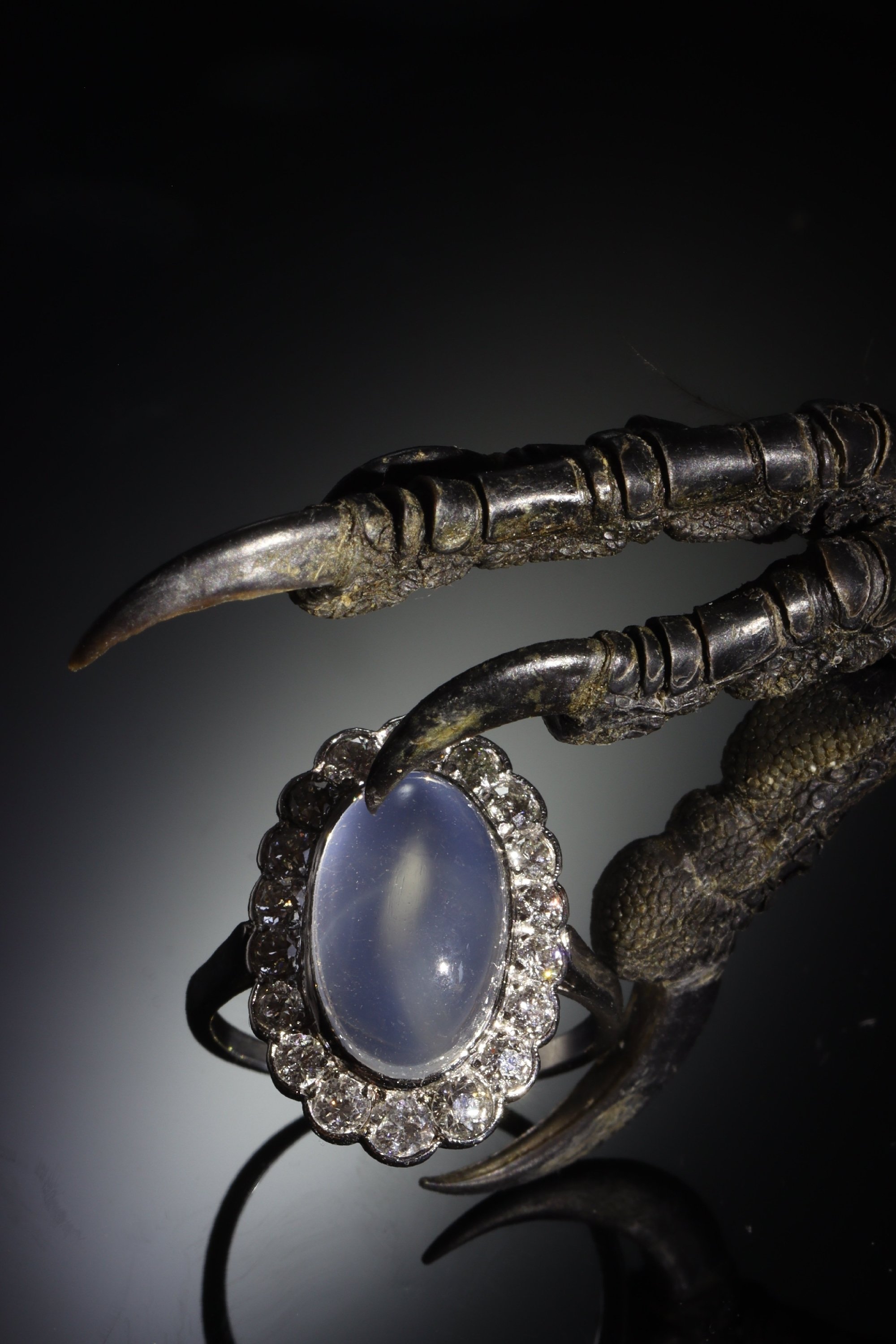 Click the picture to see more of this vintage platinum diamond ring with magnificent moonstone