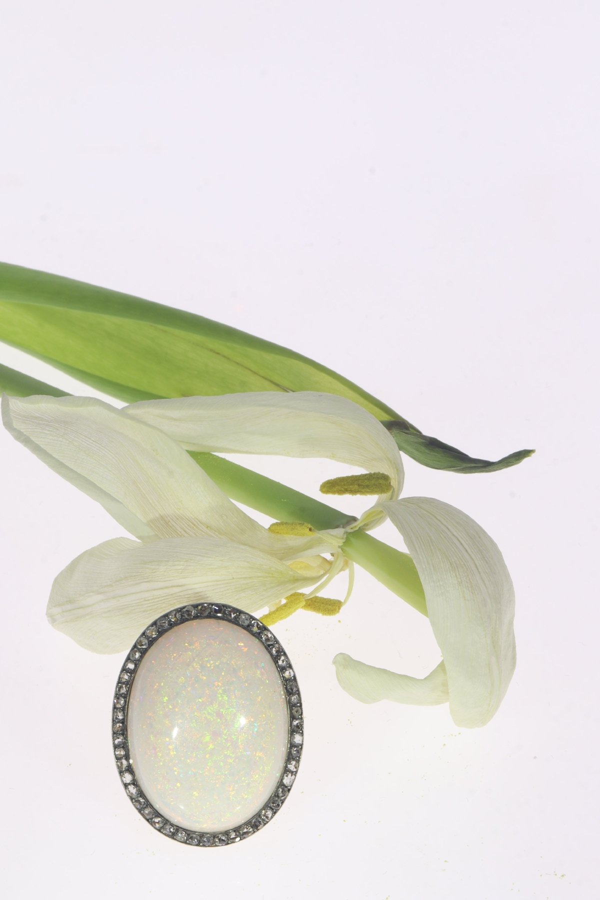 Click the picture to see more of this Vintage gold ring with humongous 30+ carat high quality opal and 56 rose cut diamonds