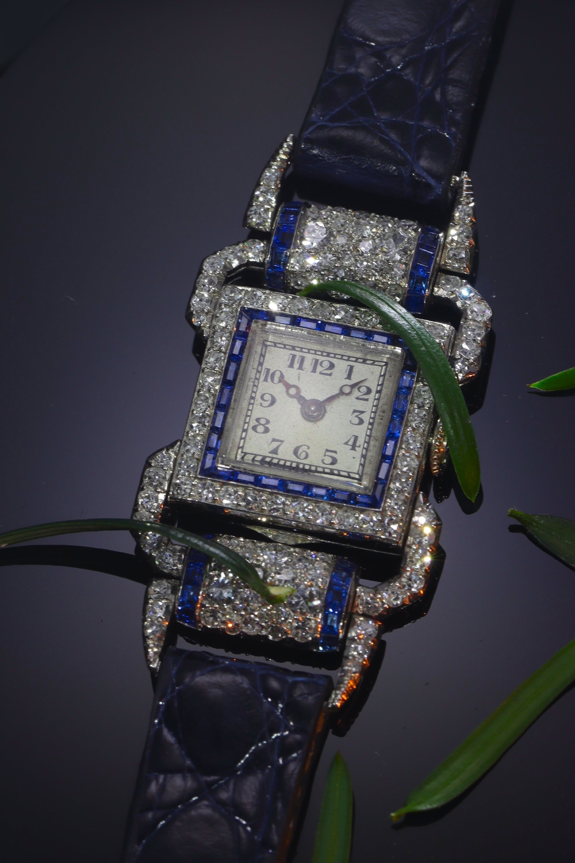 Click the picture to see of this Vintage Art Deco platinum ladies wrist watch made by Leon Hatot set with diamonds and sapphires