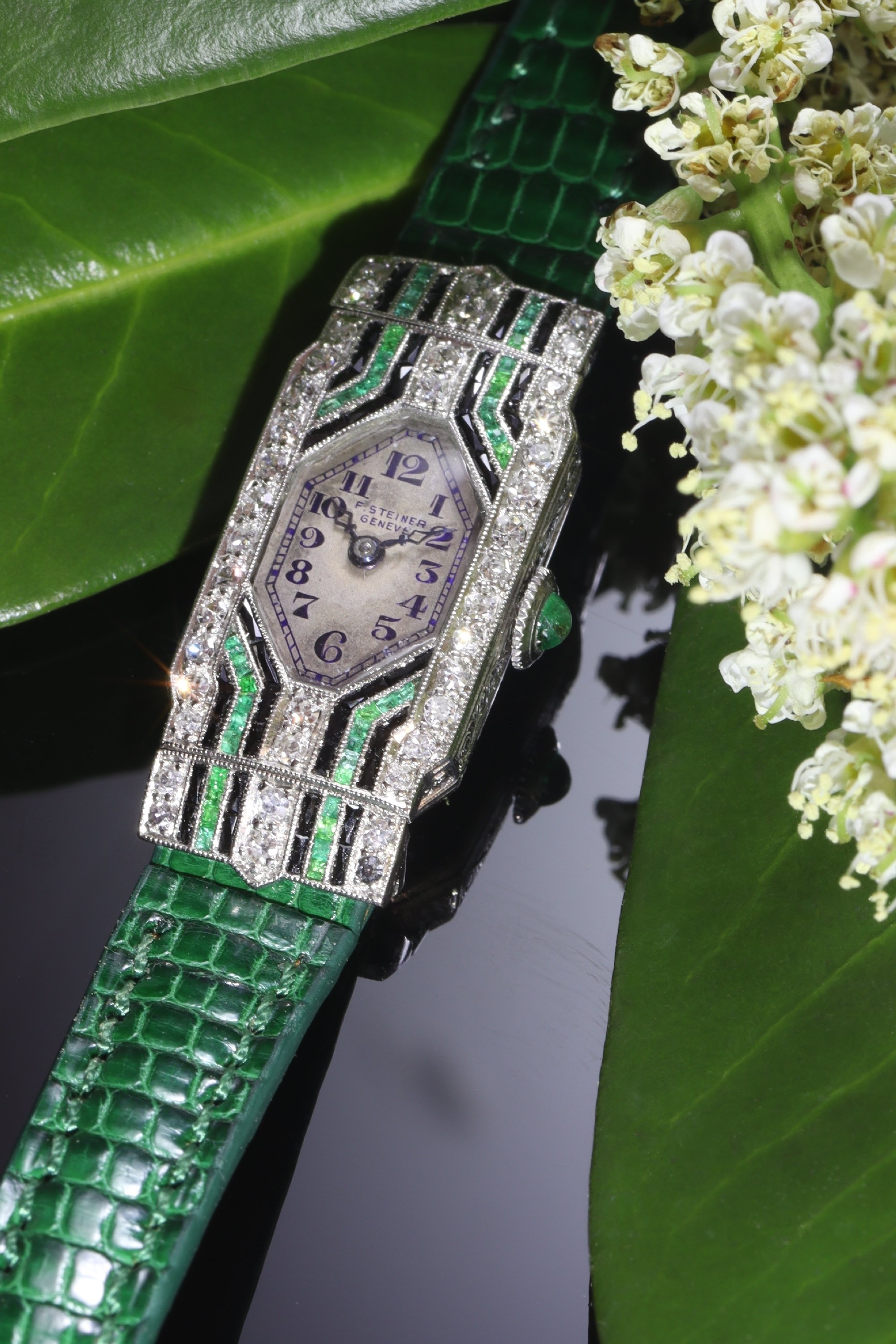 Click the picture to see of this Vintage 1930's Swiss Art Deco platinum ladies watch by F.Steiner set with diamonds, emeralds and onyx