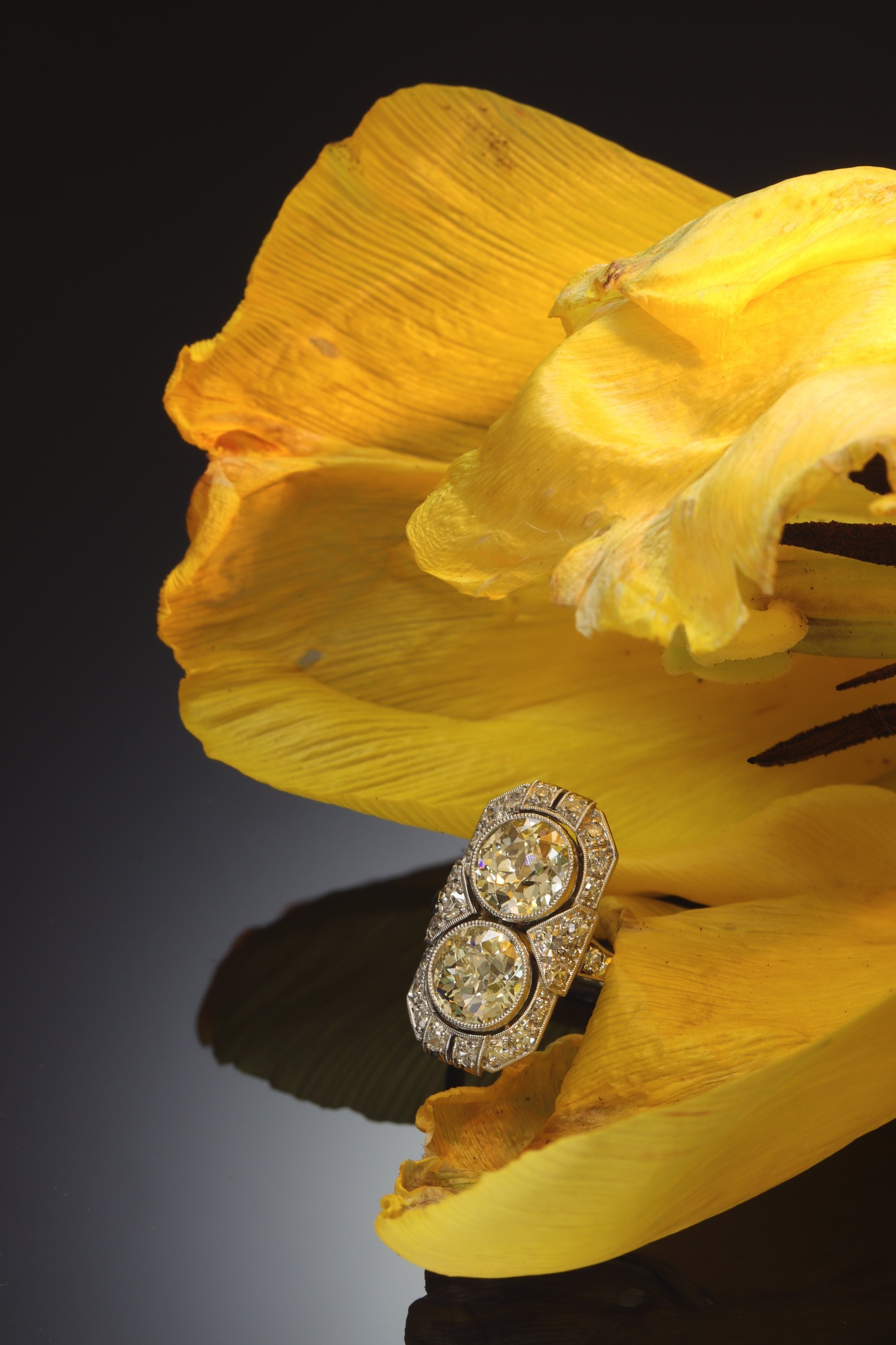 Click the picture to see of this vintage Art Deco engagement ring with two large lemon-chiffon colour brilliants