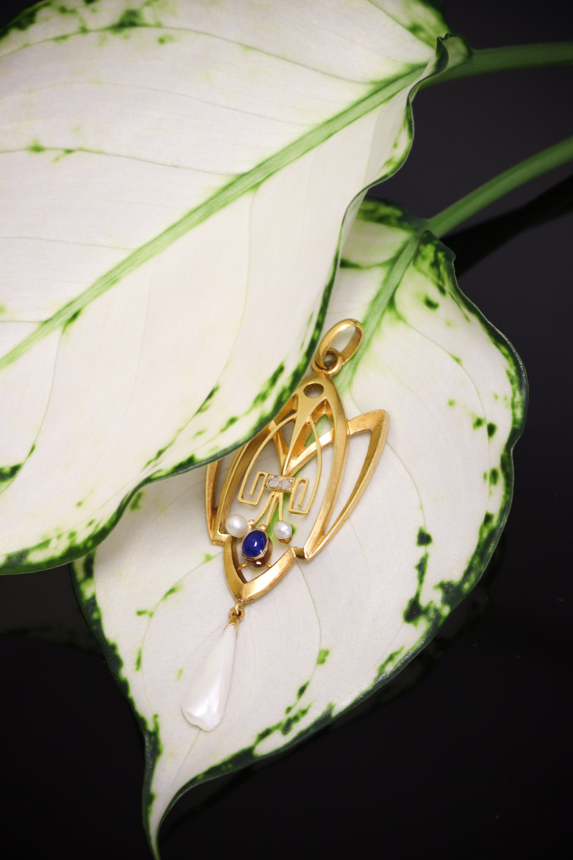 Click the picture to find out more about this Romantic Whiplash: Art Nouveau Pendant with Diamonds, Sapphire, and Rare Pearl