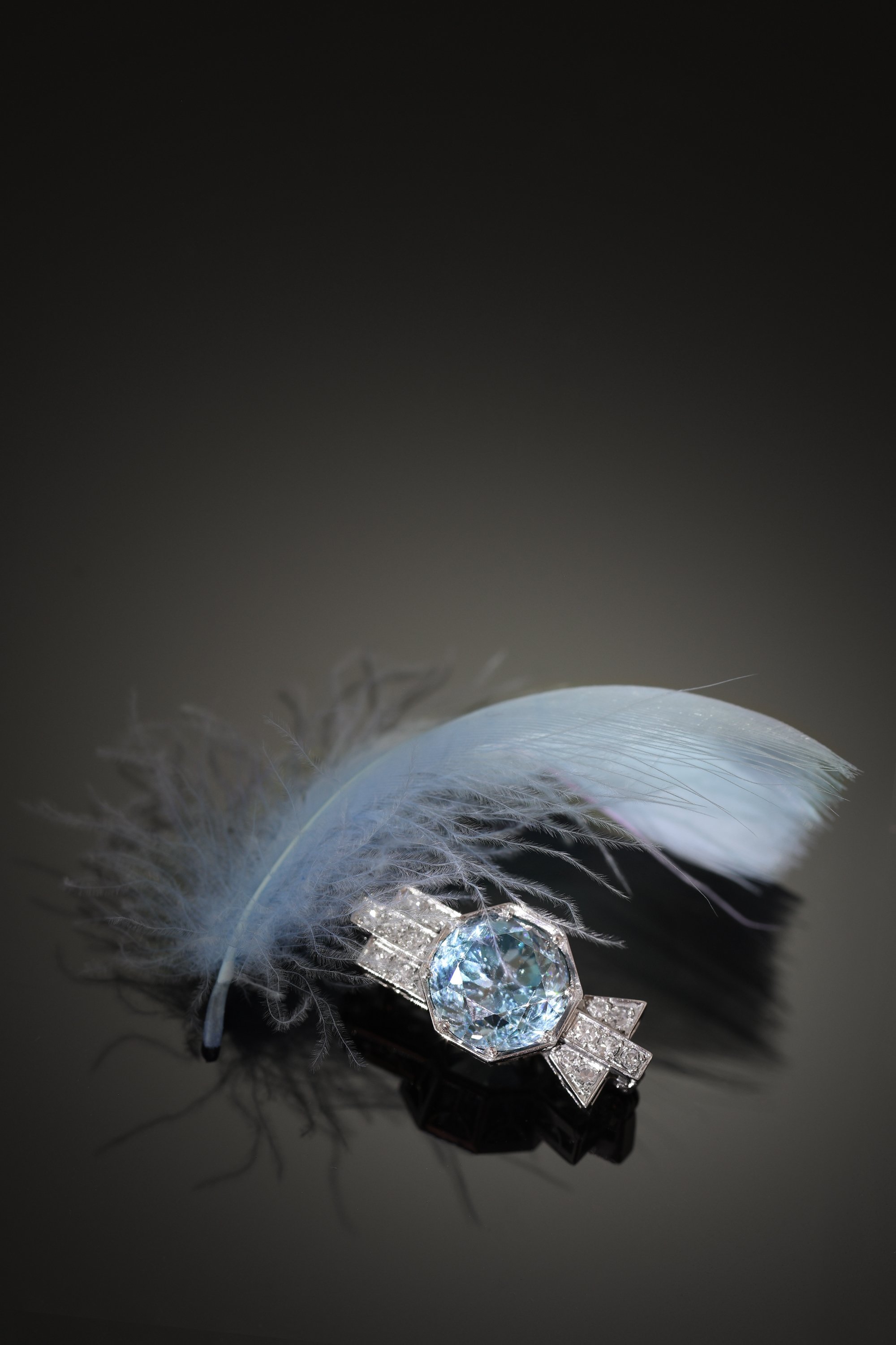 Click the picture to find out more about this 1950s Platinum Brooch with Blue Zircon � Refined Mid-Century Geometry