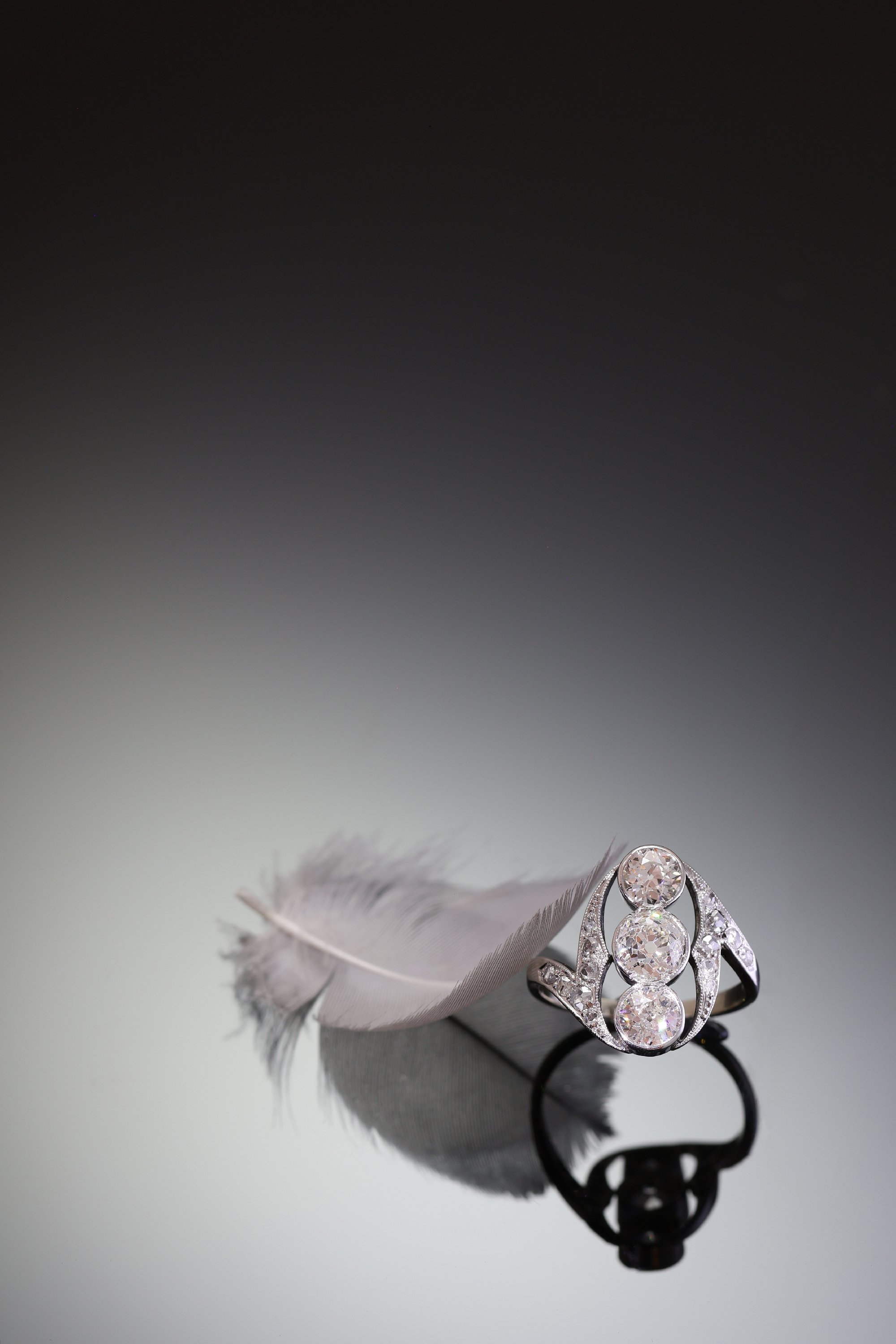 Click the picture to find out more about this Airy Belle Epoque Diamond Ring, Three Stone Design with Rose Cut Shoulders